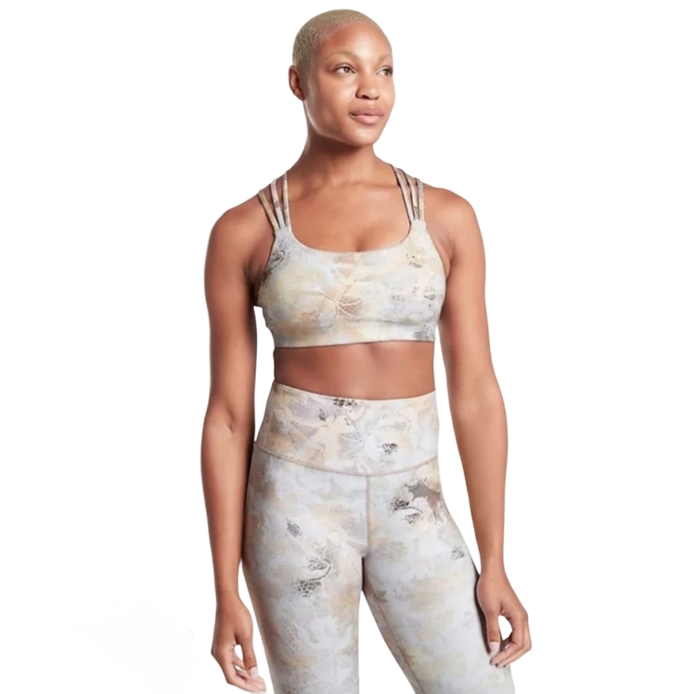 Athleta Elation Gilded Tight with gold accents.